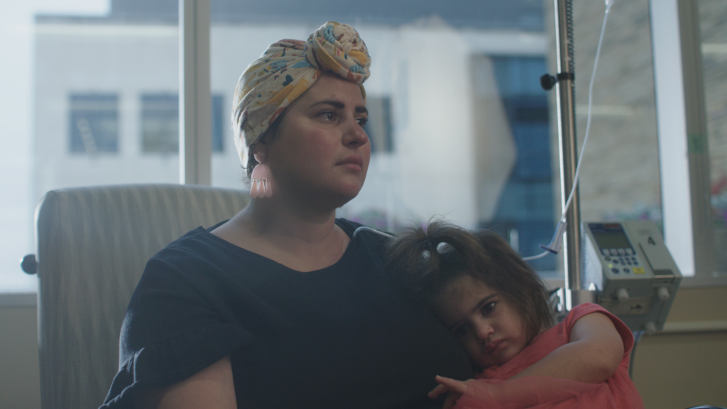 A patient sitting with her daughter after hearing her diagnosis