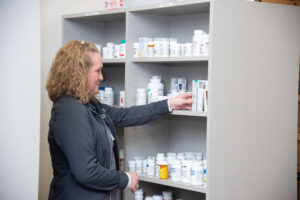 Pharmacy Technician Checks Perscriptions