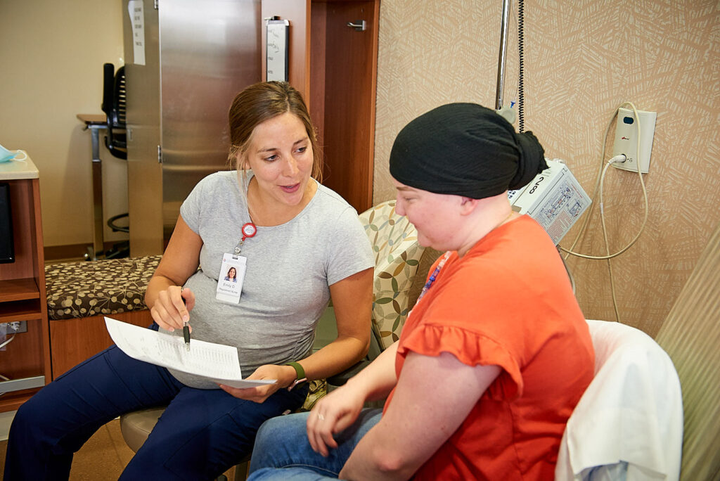 Nurse discussing treatment options with a patient